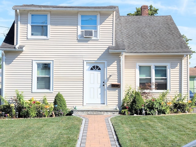 715 Burnsford Ave, Bridgeport, CT 06606 - view of front of home featuring a chimney, a front lawn, cooling unit, and a shingled roof