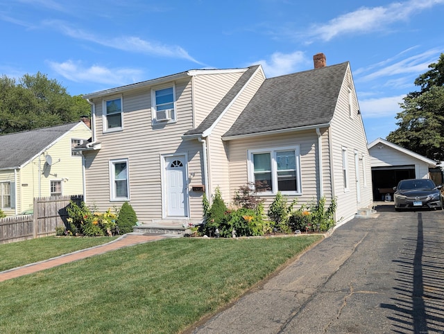 715 Burnsford Ave, Bridgeport, CT 06606 - view of front of home featuring a chimney, a garage, a shingled roof, and an outdoor structure