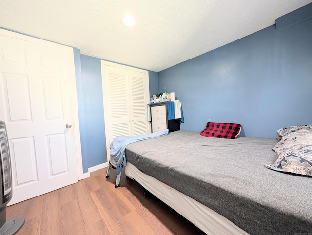 715 Burnsford Ave, Bridgeport, CT 06606 - bedroom featuring wood finished floors and a closet