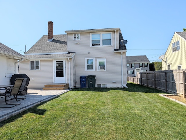 715 Burnsford Ave, Bridgeport, CT 06606 - back of property with a chimney, a patio, and a shingled roof