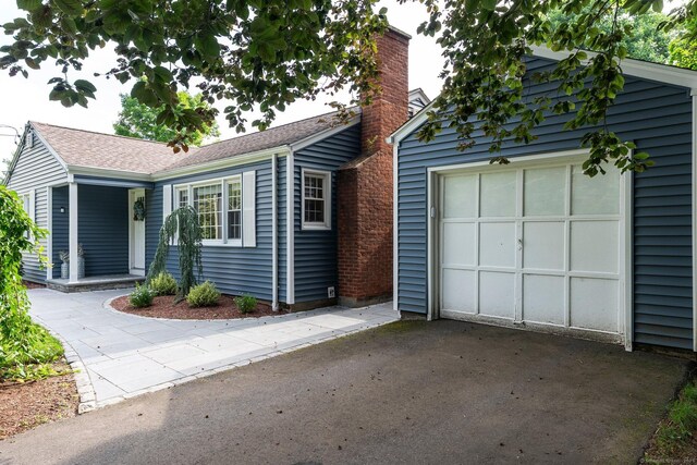 216 Main St, Glastonbury, CT 06073 - single story home with driveway and a chimney