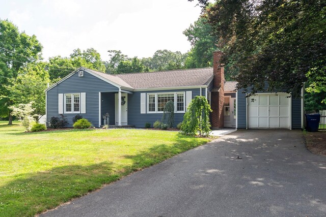 216 Main St, Glastonbury, CT 06073 - ranch-style home with asphalt driveway, a front lawn, and a chimney