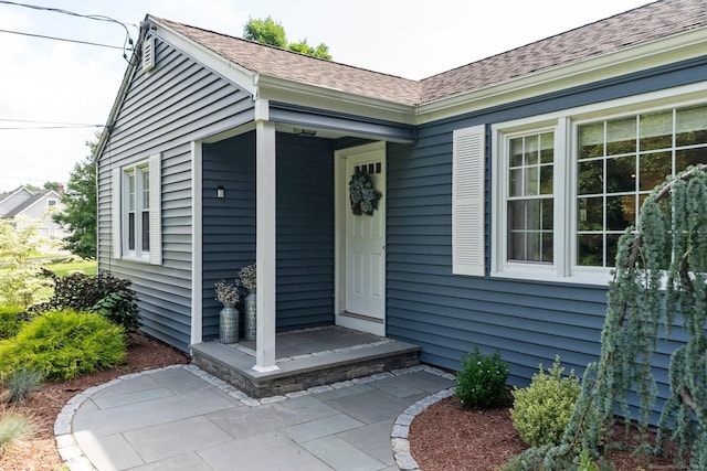 216 Main St, Glastonbury, CT 06073 - doorway to property with a shingled roof