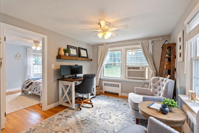 216 Main St, Glastonbury, CT 06073 - office with radiator, a ceiling fan, light wood-type flooring, and healthy amount of natural light