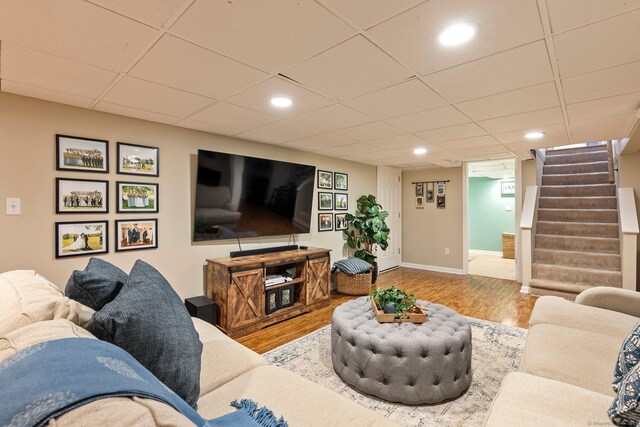 216 Main St, Glastonbury, CT 06073 - living room with wood finished floors, stairs, a paneled ceiling, and recessed lighting