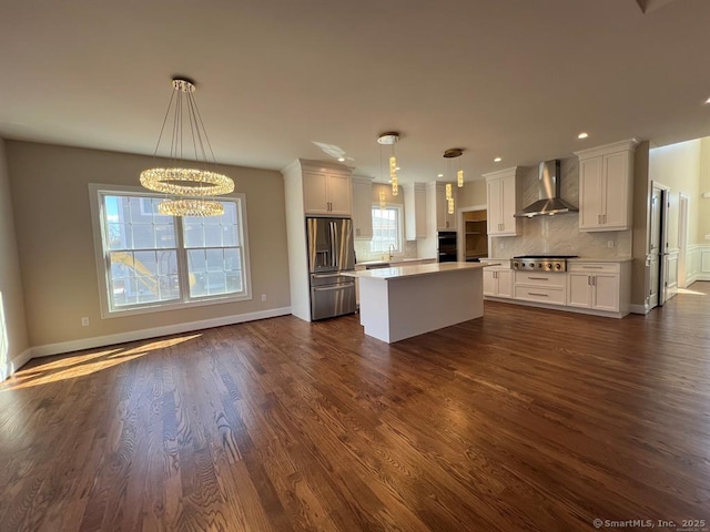 44 Primrose Ln, Cromwell, CT 06416 - kitchen with stainless steel appliances, wall chimney range hood, healthy amount of natural light, white cabinets, and recessed lighting