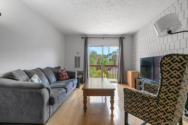 125 Olive St Apt D2, New Haven, CT 06511 - living area featuring hardwood / wood-style flooring and a textured ceiling