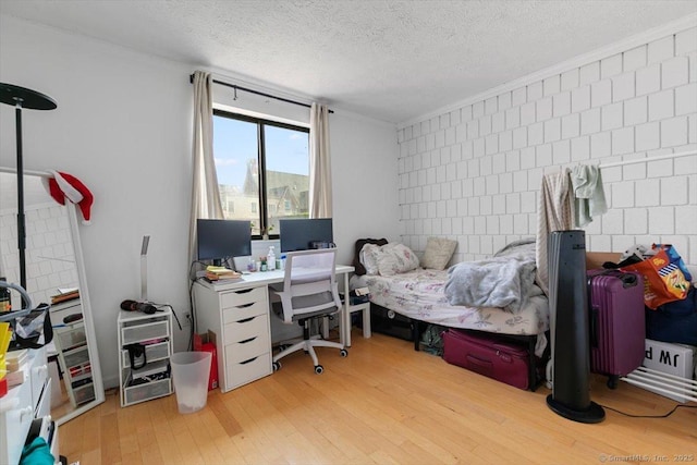 125 Olive St Apt D2, New Haven, CT 06511 - bedroom featuring wood finished floors, a desk, and a textured ceiling