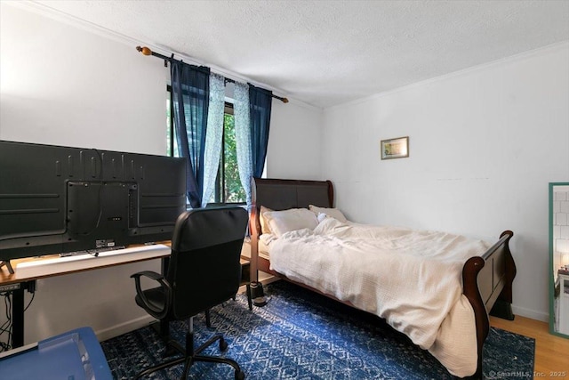 125 Olive St Apt D2, New Haven, CT 06511 - bedroom featuring ornamental molding, a textured ceiling, wood finished floors, and an office area