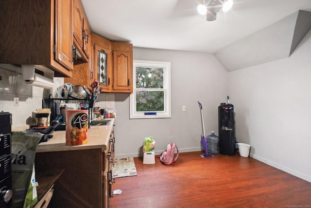 32 Williams St, Bristol, CT 06010 - kitchen with a ceiling fan, brown cabinets, wood finished floors, light countertops, and vaulted ceiling