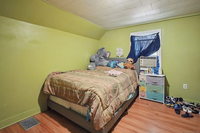 32 Williams St, Bristol, CT 06010 - bedroom with wood finished floors, cooling unit, and vaulted ceiling