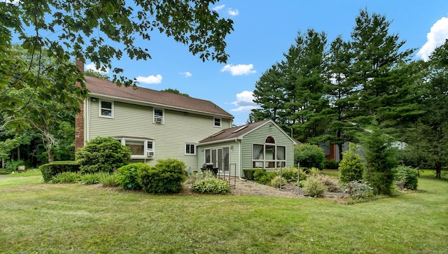 186 Wood Pond Rd, South Windsor, CT 06074 - rear view of property featuring a lawn