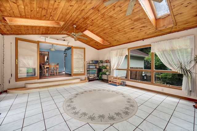 186 Wood Pond Rd, South Windsor, CT 06074 - spare room with a skylight, lofted ceiling, wood ceiling, tile patterned flooring, and ceiling fan