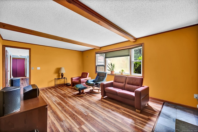 186 Wood Pond Rd, South Windsor, CT 06074 - living area with a textured ceiling, beamed ceiling, and wood finished floors