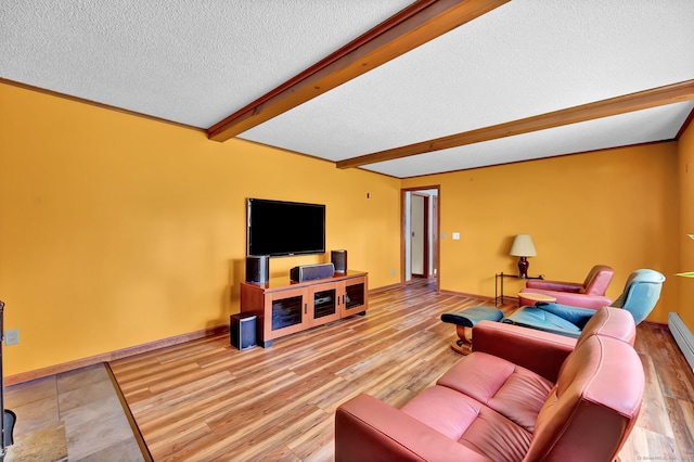 186 Wood Pond Rd, South Windsor, CT 06074 - living room with a textured ceiling, beamed ceiling, and wood finished floors