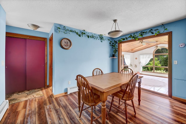 186 Wood Pond Rd, South Windsor, CT 06074 - dining area featuring baseboard heating, wood finished floors, a textured ceiling, and ceiling fan