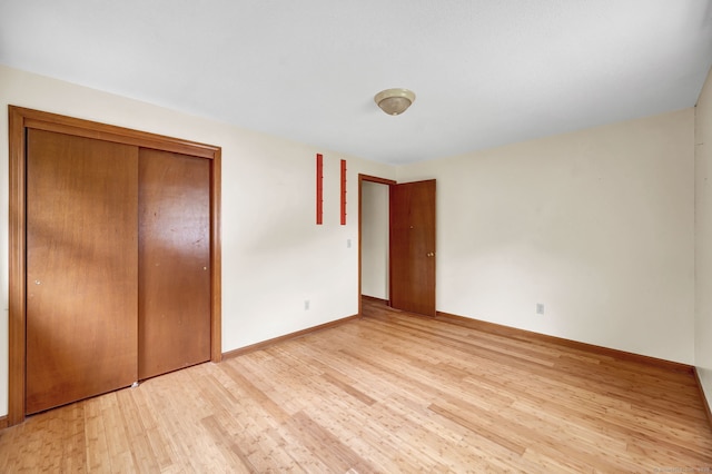 186 Wood Pond Rd, South Windsor, CT 06074 - unfurnished bedroom featuring wood finished floors and a closet