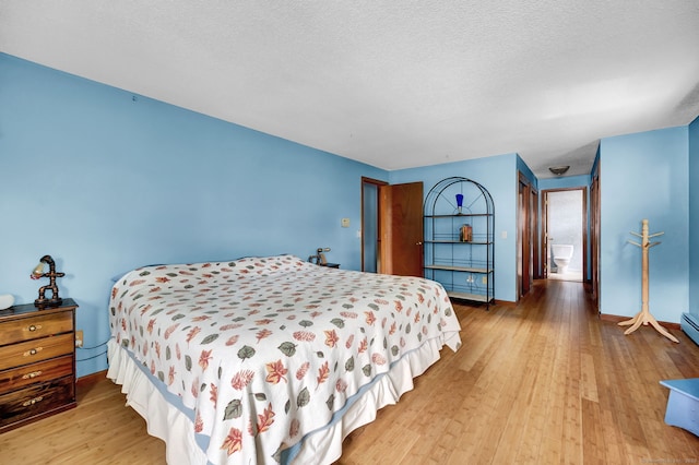 186 Wood Pond Rd, South Windsor, CT 06074 - bedroom featuring wood finished floors and a textured ceiling