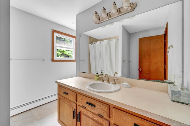 186 Wood Pond Rd, South Windsor, CT 06074 - bathroom with a baseboard heating unit and vanity