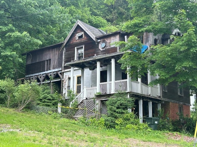 109 Clay St, Thomaston, CT 06787 - view of front facade with covered porch and a view of trees