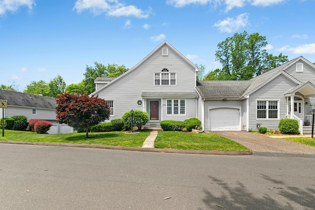 376 Woodridge Unit 376, Shelton, CT 06484 - traditional-style home featuring a garage, asphalt driveway, a front lawn, and a shingled roof