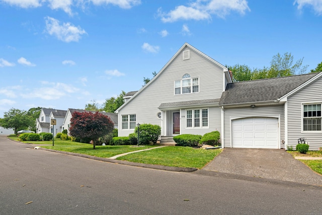 376 Woodridge Unit 376, Shelton, CT 06484 - traditional home with an attached garage, driveway, a front lawn, and a shingled roof