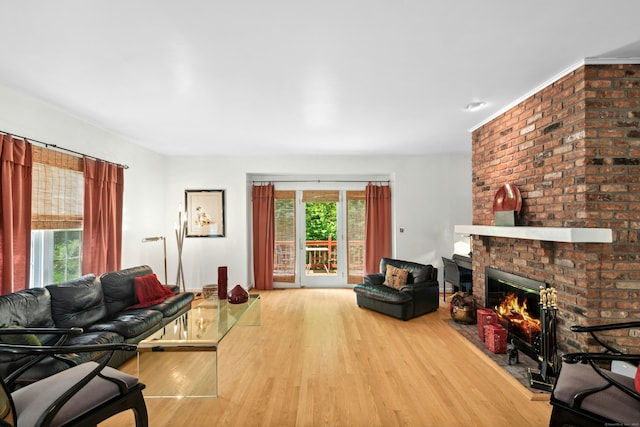 376 Woodridge Unit 376, Shelton, CT 06484 - living room featuring wood finished floors and a fireplace