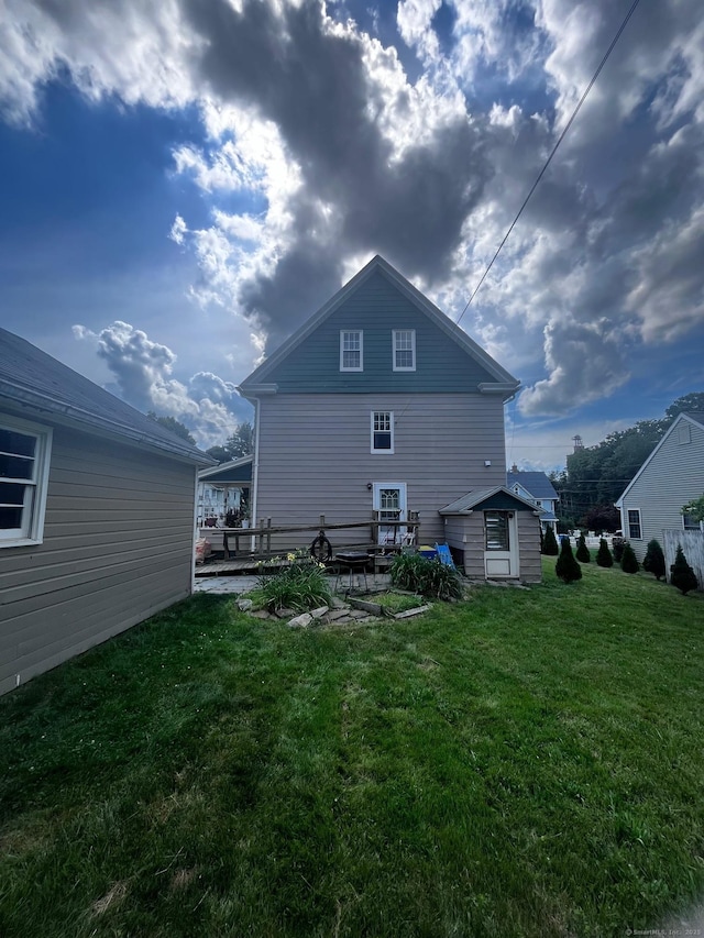 9 Starkweather St, Manchester, CT 06042 - rear view of house featuring a storage shed, a yard, and a patio