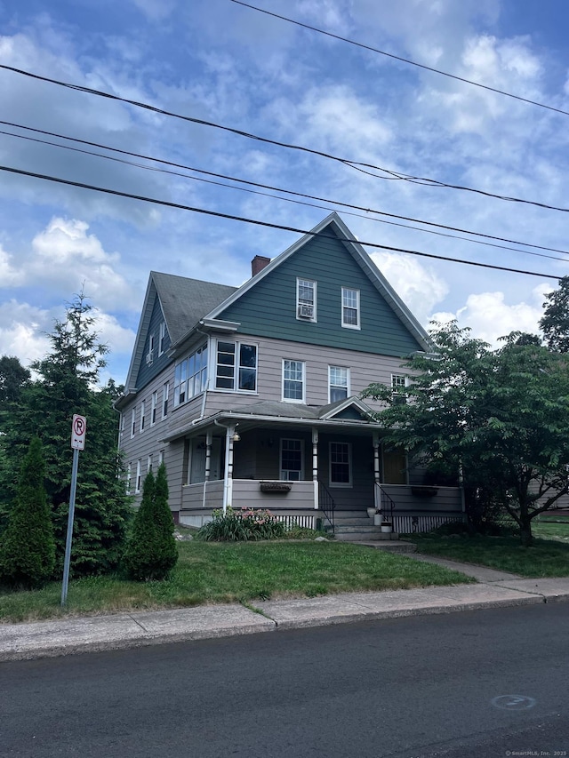 9 Starkweather St, Manchester, CT 06042 - view of front facade with covered porch and a chimney