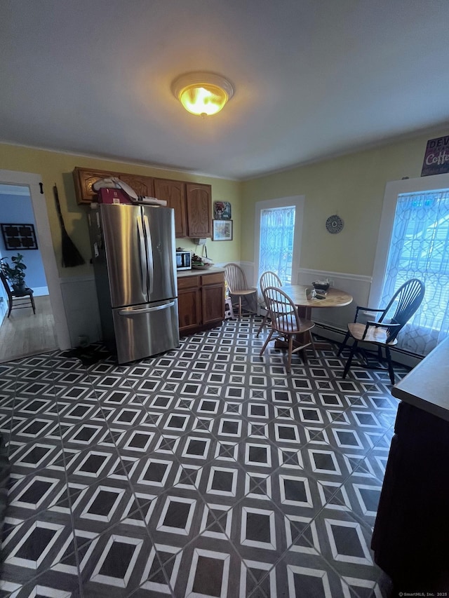 9 Starkweather St, Manchester, CT 06042 - kitchen with freestanding refrigerator, light countertops, and wainscoting