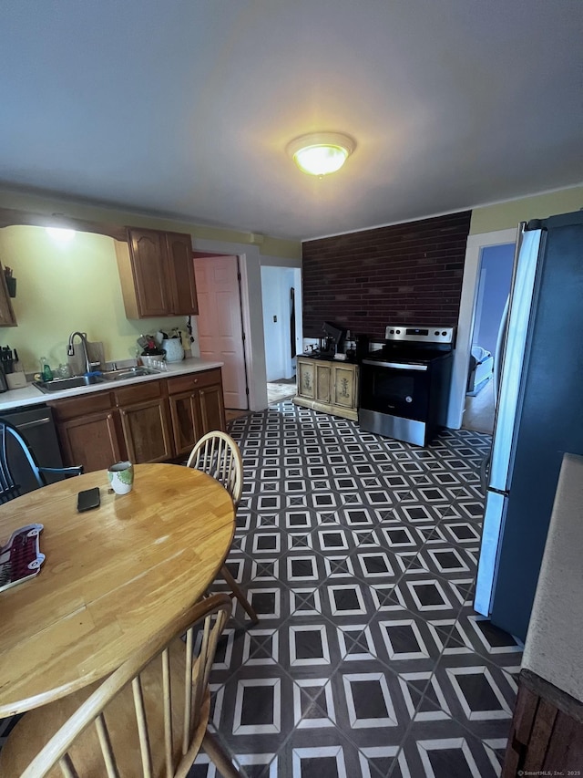 9 Starkweather St, Manchester, CT 06042 - kitchen with appliances with stainless steel finishes and light countertops