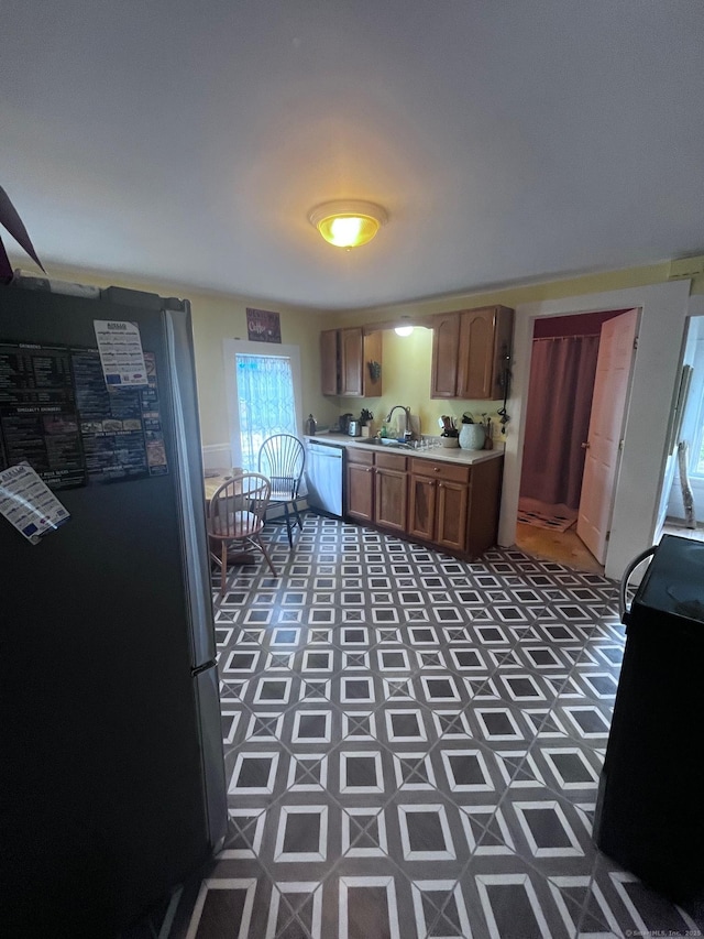 9 Starkweather St, Manchester, CT 06042 - kitchen featuring freestanding refrigerator, range, light countertops, and dishwashing machine