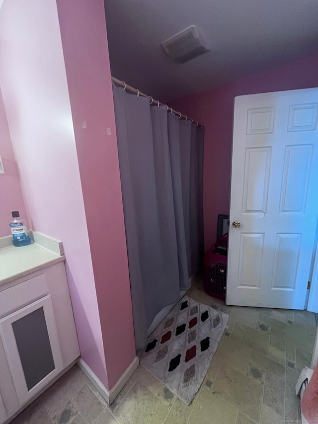 9 Starkweather St, Manchester, CT 06042 - full bath with a shower with curtain, stone finish floors, and vanity