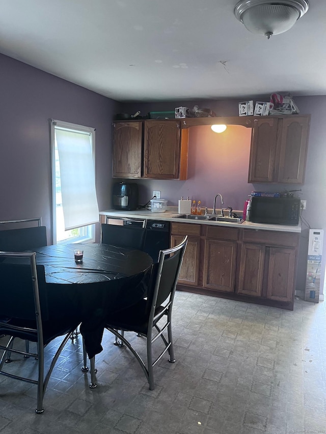 9 Starkweather St, Manchester, CT 06042 - kitchen with black microwave, light countertops, and light floors