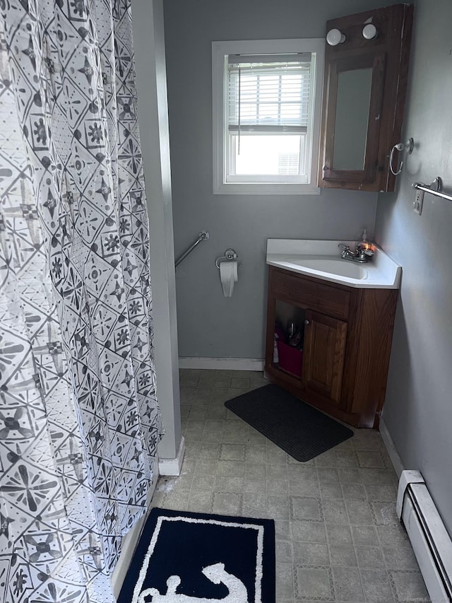 9 Starkweather St, Manchester, CT 06042 - full bath featuring a baseboard radiator, vanity, and a shower with shower curtain