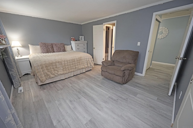 44 Hitching Post Ln Unit 44, Glastonbury, CT 06033 - bedroom featuring light wood-style flooring and ornamental molding