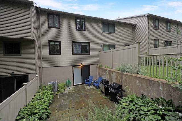 44 Hitching Post Ln Unit 44, Glastonbury, CT 06033 - rear view of property with a patio area