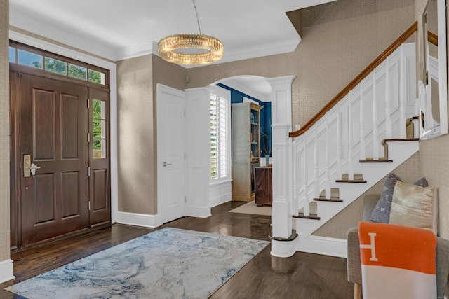 8 Jacob Ln, Killingworth, CT 06419 - foyer with dark wood finished floors, ornamental molding, arched walkways, stairway, and wallpapered walls