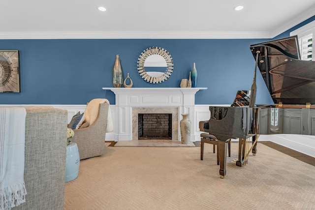 8 Jacob Ln, Killingworth, CT 06419 - living room featuring crown molding, wainscoting, recessed lighting, a premium fireplace, and a decorative wall