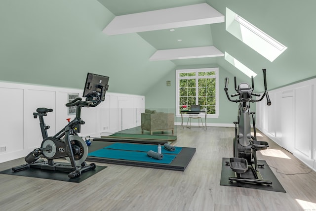 8 Jacob Ln, Killingworth, CT 06419 - exercise area with wood finished floors, a skylight, a decorative wall, and lofted ceiling
