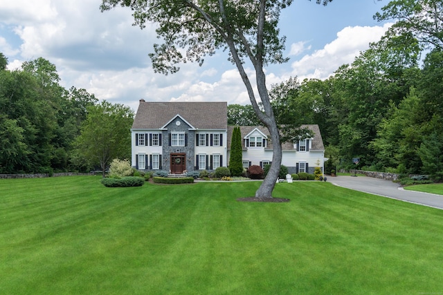 8 Jacob Ln, Killingworth, CT 06419 - colonial-style house featuring a front lawn and stone siding