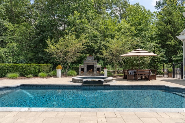 8 Jacob Ln, Killingworth, CT 06419 - view of pool with exterior fireplace, a patio area, and a pool with connected hot tub