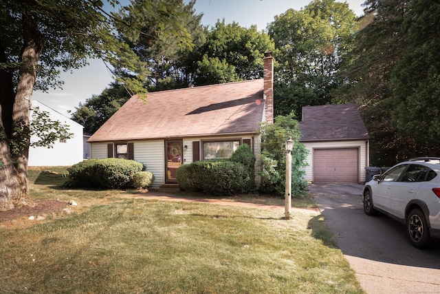 282 Curtiss St, Southington, CT 06489 - view of front of home featuring asphalt driveway, a front yard, a garage, a chimney, and a shingled roof