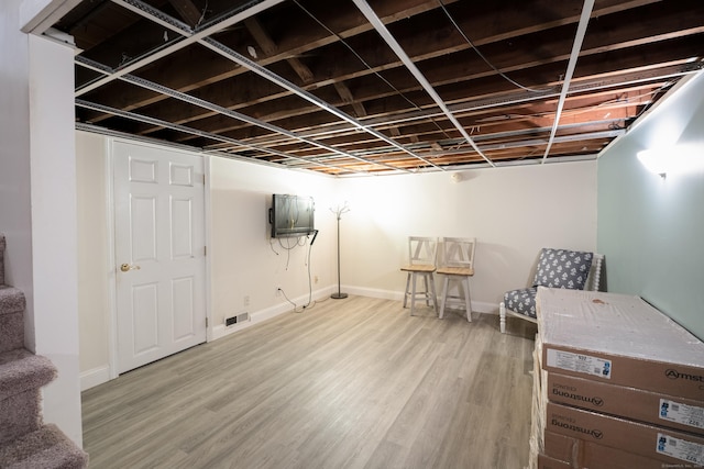 282 Curtiss St, Southington, CT 06489 - finished basement featuring wood finished floors and baseboards