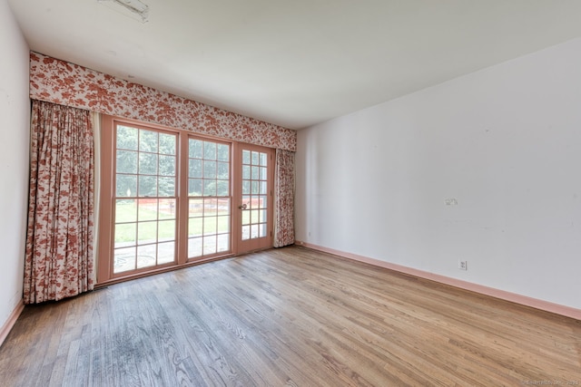 43 Buckfield Ln, Greenwich, CT 06831 - empty room with wood finished floors and baseboards
