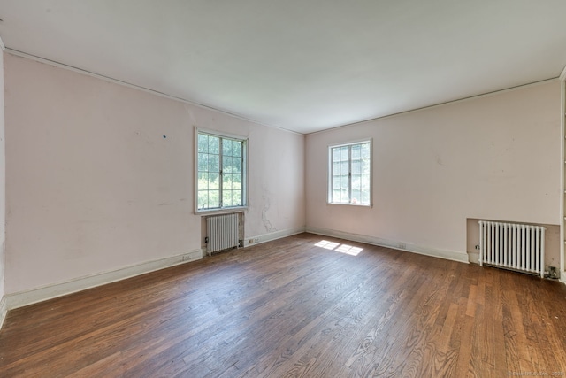 43 Buckfield Ln, Greenwich, CT 06831 - unfurnished room with radiator heating unit and wood finished floors