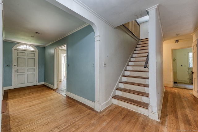 43 Buckfield Ln, Greenwich, CT 06831 - stairs with crown molding, wood finished floors, and arched walkways