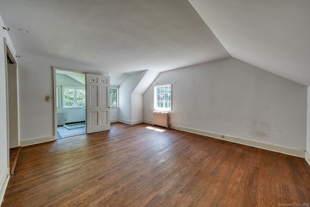 43 Buckfield Ln, Greenwich, CT 06831 - bonus room with radiator heating unit, lofted ceiling, plenty of natural light, and wood finished floors
