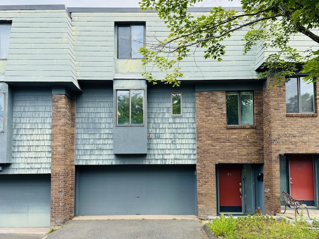 93 Trolley Crossing Ln Unit 93, Middletown, CT 06457 - view of front of house featuring an attached garage and asphalt driveway
