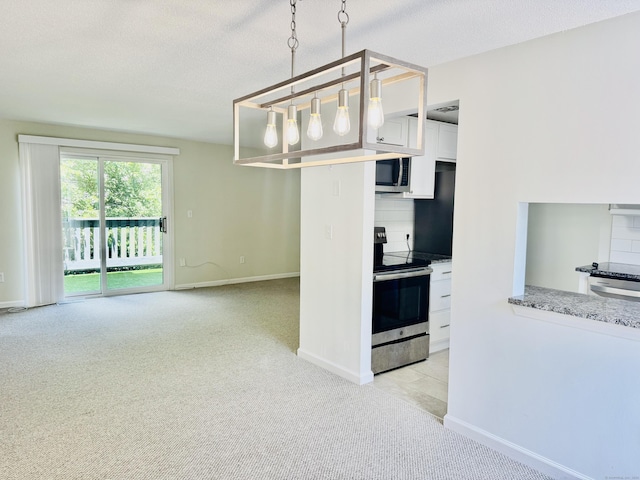 93 Trolley Crossing Ln Unit 93, Middletown, CT 06457 - kitchen featuring appliances with stainless steel finishes, light carpet, white cabinets, backsplash, and light stone countertops